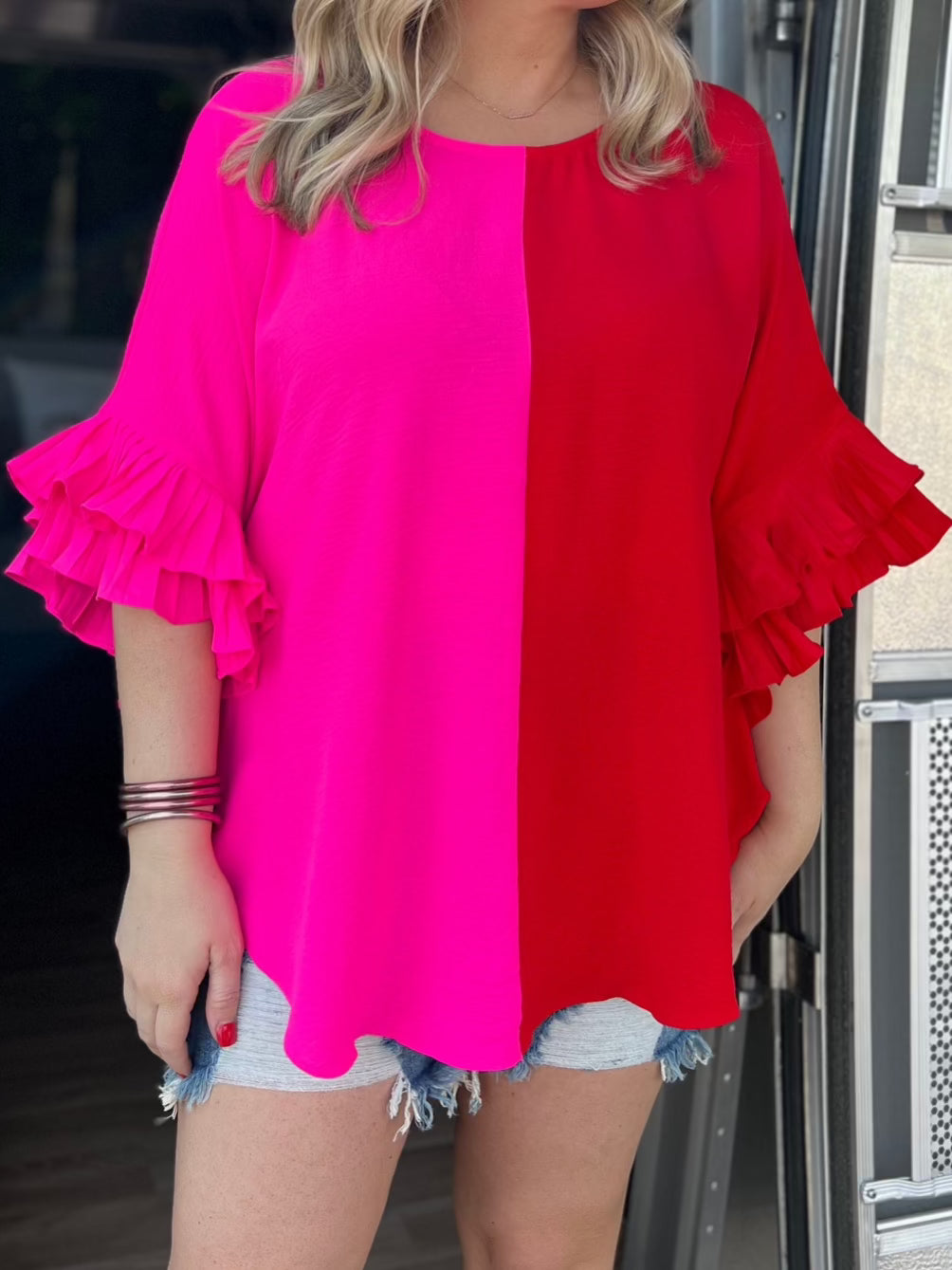pink half red half top with ruffle sleeves
